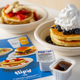 Flip'd by IHOP product shot of two pancake bowls dressed with fruit and whipped cream